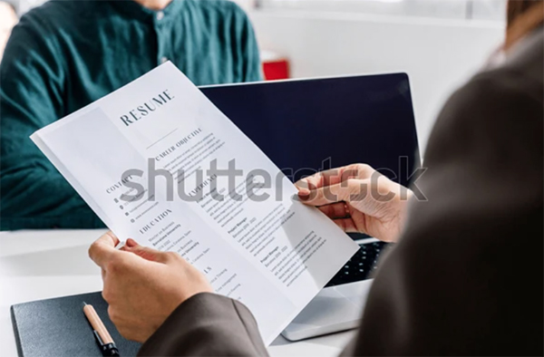 Hands of Recruiter Holding Resume Hands of Recruiter Holding Resume